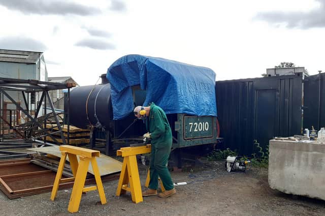 Work taking place in front of the steam box, part of the Hengist locomotive.