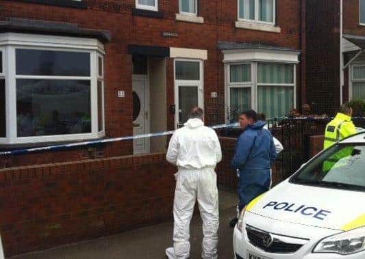 Forensics officers outside Julie's home in Station Road following the discovery of the bodies.