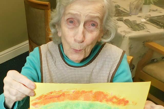 The Laurels and The Limes Care Home resident Margaret Young with her rainbow card