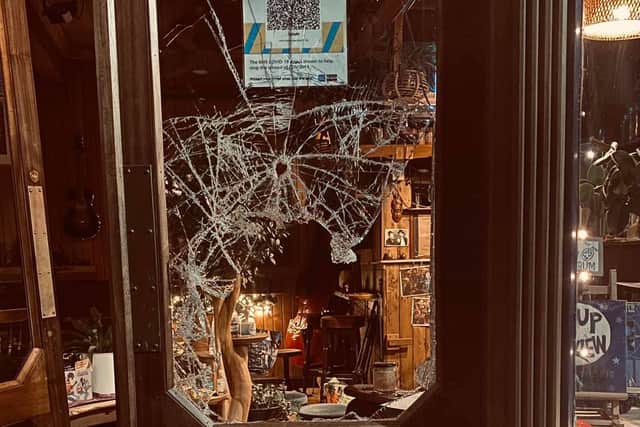 The smashed window at Cafe #9.