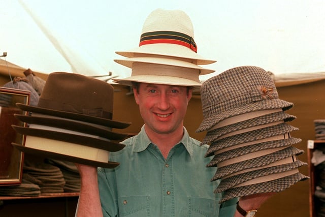 Andrew Earland from Earland Brothers with a few of his hats for sale in 1998