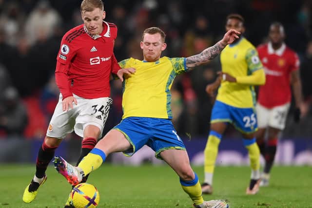 Donny van de Beek of Manchester United battles for possession with Lewis O'Brien of Nottingham Forest (Stu Forster/Getty Images)