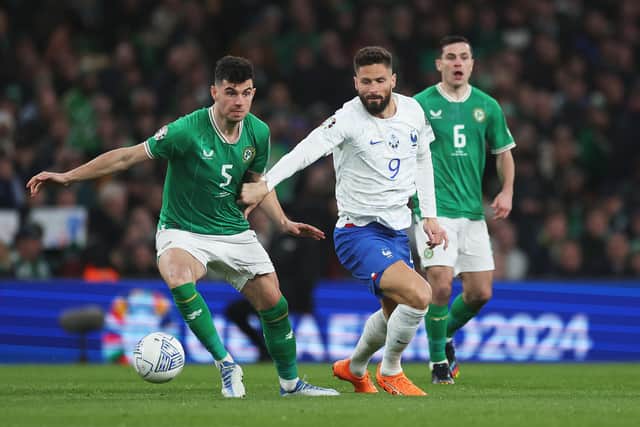 John Egan of Republic of Ireland is put under pressure by Olivier Giroud of France: Oisin Keniry/Getty Images