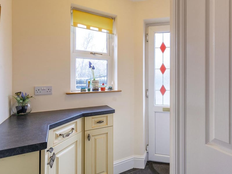 The entrance hall provides access to a WC and the kitchen.