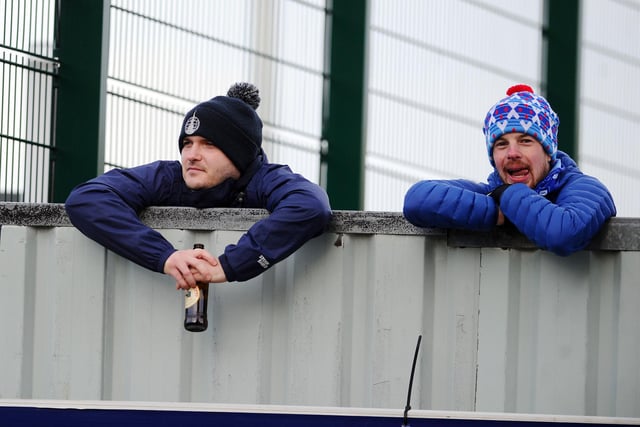 Falkirk fans find a vantage point to watch the game.