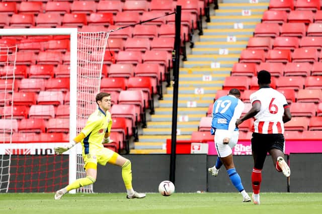 Adan George of Birmingham City scores their side's first goal past Marcus Dewhurst of Sheffield United during the Premier Development League Play Off Final match between Sheffield United U23 and Birmingham City U23 at Bramall Lane on May 24, 2021 in Sheffield, England. (Photo by George Wood/Getty Images)