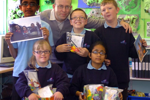 Pupils at Seven Hills School with shoe boxes they are sending to kids in Bosnia back in 2009