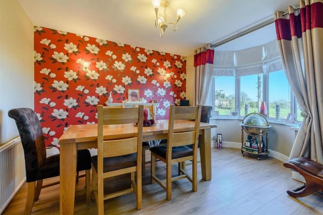 Meal times could not be more pleasant in this dining room, which features a brick-built fireplace with a traditional-style surround and potential for a log burner. A double-glazed bay window offers lovely open views across neighbouring paddock land and beyond.