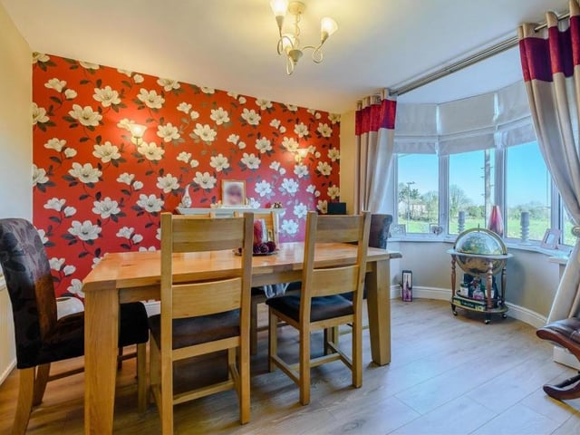 Meal times could not be more pleasant in this dining room, which features a brick-built fireplace with a traditional-style surround and potential for a log burner. A double-glazed bay window offers lovely open views across neighbouring paddock land and beyond.