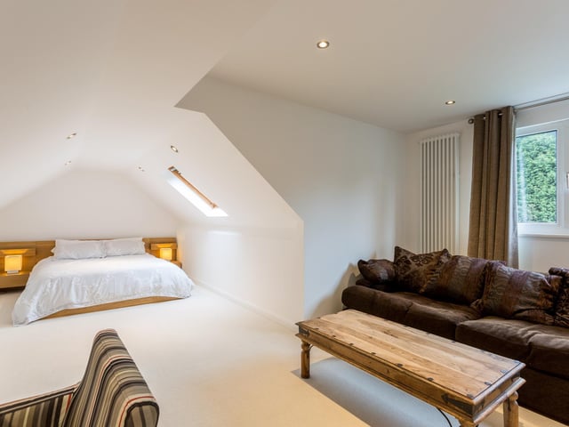 This large room has an area that can be used as a sitting room.