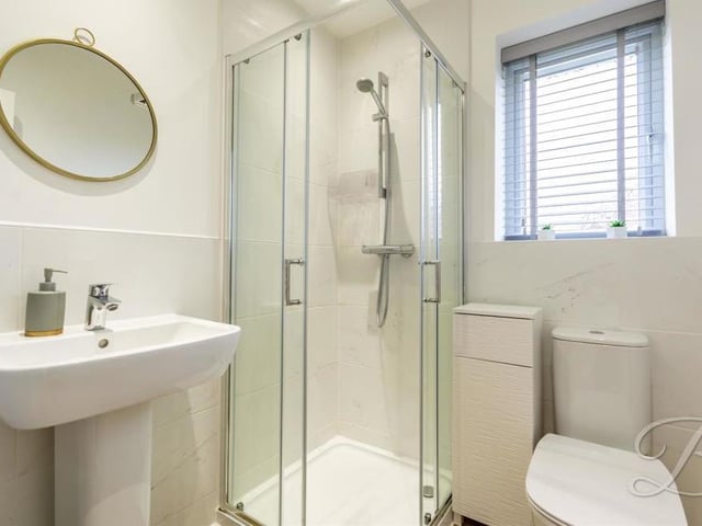 The excellent en suite to the master bedroom comes complete with a walk-in shower, low-flush WC, pedestal wash basin and opaque window to the back.
