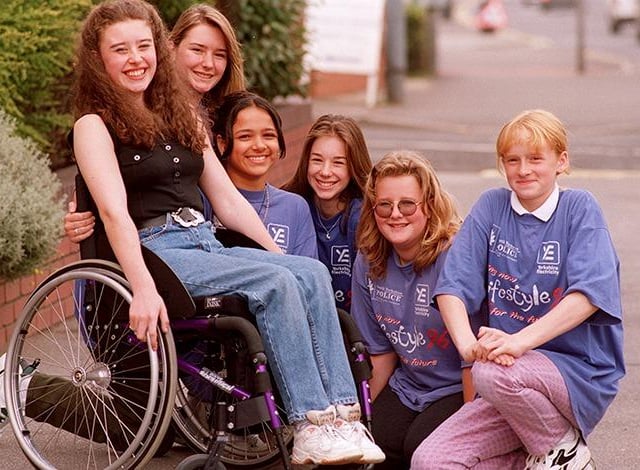 Julie Neyt (15) receives her new wheelchair from the Handsworth Lifestyle team, Rebecca Allsopp, Sundip Bal, Francesca Allsopp, Jeanne Whonersley and Laura Rickers at Attercliffe Police Station on September 2, 1996