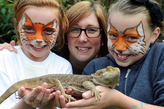 A reminder of the Foxden's open day in 2014. Zoo Academy's Sarah Brown, centre, shows Dougie the Bearded Dragon to youngsters Sophie Duerden and Hannah Oxley.