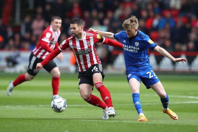 Oliver Norwood of Sheffield United and Tommy Doyle of Cardiff City during last season's Sky Bet Championship match at Bramall Lane: Simon Bellis / Sportimage
