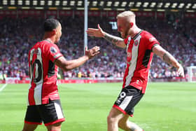 Cameron Archer celebrates scoring his first goal with Oliver McBurnie during the Premier League match against Everton at Bramall Lane. Simon Bellis / Sportimage