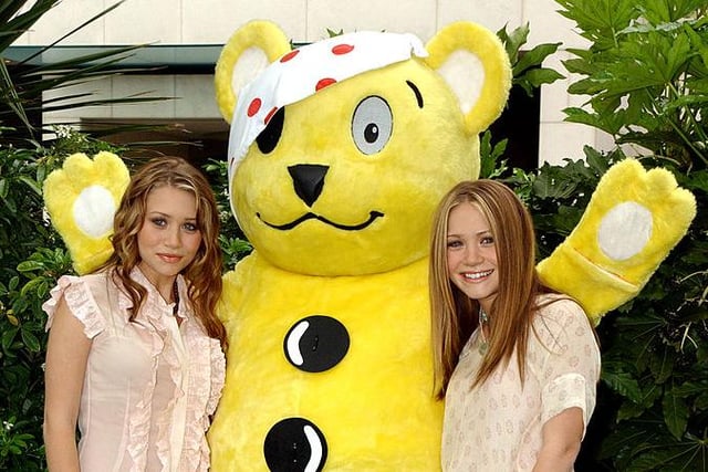 Pudsey has met a host of celebrities over the years, including iconic actors Mary-Kate and Ashley Olsen in 2002 (Photo: Anthony Harvey/Getty Images)