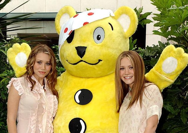 Pudsey has met a host of celebrities over the years, including iconic actors Mary-Kate and Ashley Olsen in 2002 (Photo: Anthony Harvey/Getty Images)
