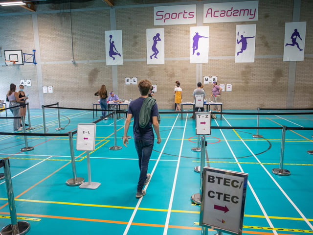 Social distance measures in place at the sports hall where students collect their results at Portsmouth College. Picture: Habibur Rahman