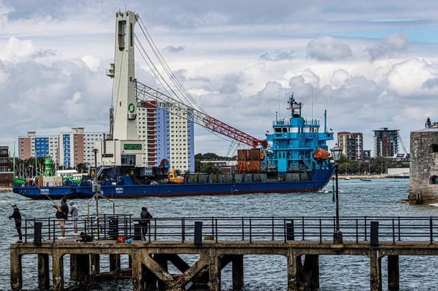 Meri arrives in Portsmouth Harbour with the Portico crane.