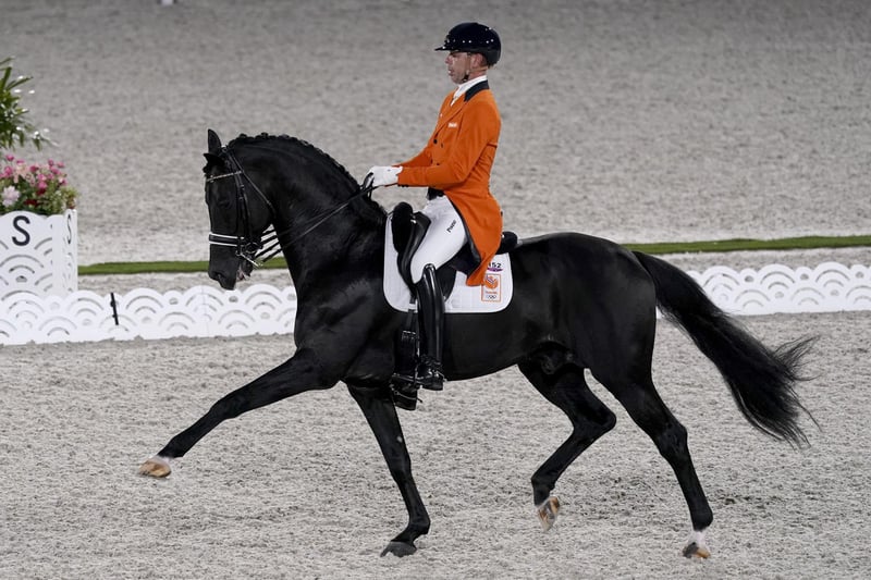 The Netherlands' Hans Peter Minderhoud, riding Dream Boy, competes in the equestrian dressage team final at the 2020 Summer Olympics