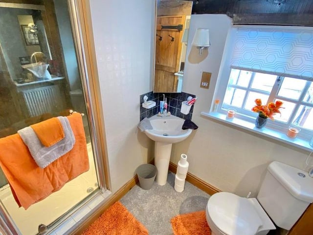 Cute is the best way to describe this shower room. It includes a walk-in shower, wash hand basin and low-flush WC, not forgetting a beamed ceiling.