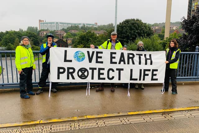 Extinction Rebellion Sheffield activists meet in Sheffield city centre to unfurl a series of banners, which they hope will highlight the current climate and ecological crisis