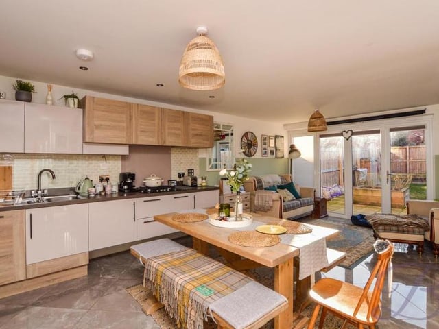 Modern living at the Ollerton property equates to this vast kitchen and living area. The kitchen comes complete with quality cabinets and units, offering plentiful storage space, and a complementary work surface, plus a stainless steel sink and drainer with a mixer tap above. The room is filled with natural light from bi-folding doors.
