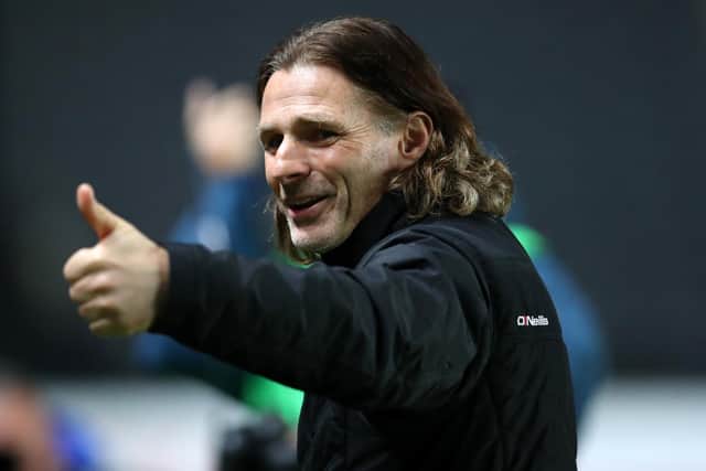 Wycombe Wanderers boss Gareth Ainsworth will miss today's clash with Sheffield Wednesday after undergoing back surgery yesterday.