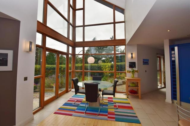 Marvel at the full-height windows in this family area, which is the perfect social space. There is a seating area, a dining area and French doors that open out to the patio at the back of the property.