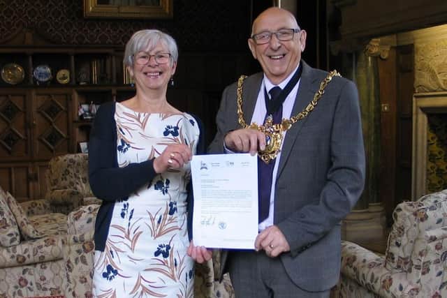 Julie Pearn, chair of Sheffield Labour Friends of Palestine, presents then Lord Mayor of Sheffield Coun Tony Downing in  2019 with a letter from the Mayor of Nablus, inviting the city to enter into a twinning arrangement