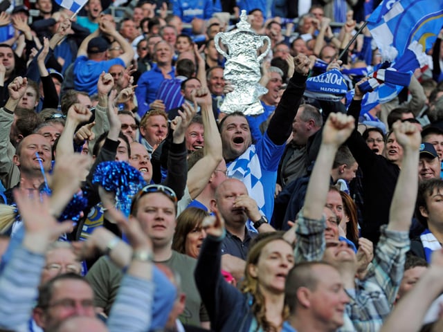 Pompey fans celebrate the 2-0 extra-time win over Spurs.