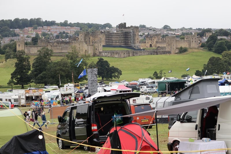 Campers at the 2021 Mighty Dub Fest within sight of the magnificent Alnwick Castle.