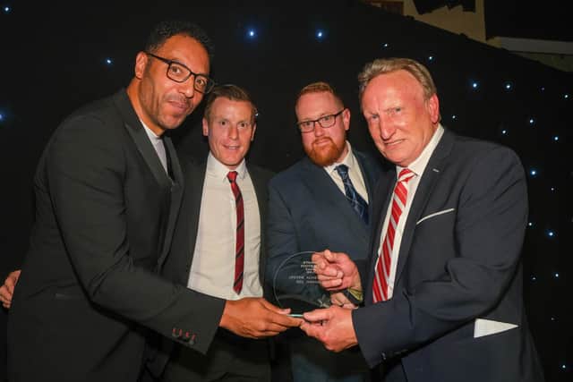 Neil Warnock receives his Lifetime achievement award from Carl Asaba and Rob Kozluk