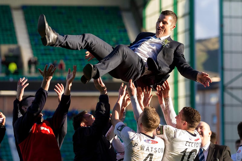 Raith manager Grant Murray is thrown into the air as the post-match celebrations begin.