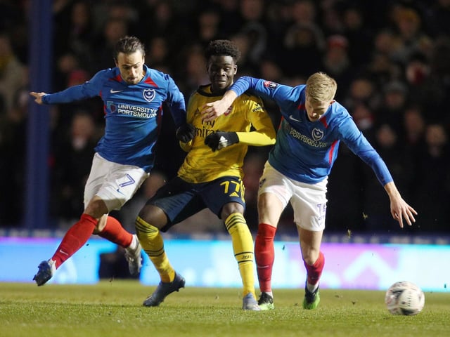 Portsmouth duo Ryan Williams and Ross McCrorie compete for the ball