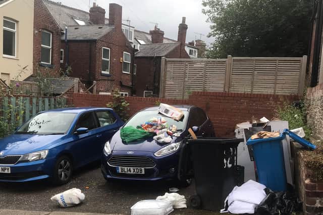 Rubbish has been left strewn over cars and over-spilling in front of houses on Sharrow Vale Road.