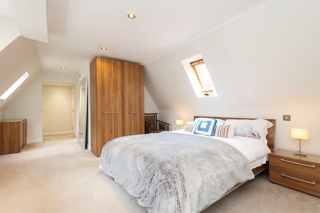 This bedroom has an en-suite and skylights.