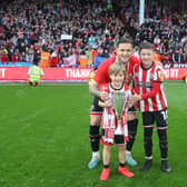 Sheffield United legend Billy Sharp with his children in front of The Kop at Bramall Lane: Simon Bellis / Sportimage