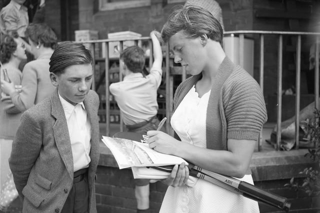 Tennis star Ann Haydon is pictured signing autographs at Ashbrooke, Sunderland, where she was appearing in the Durham County Lawn Tennis championships in 1958.