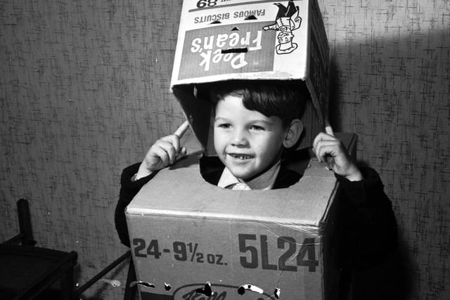 Michael Haughian from Clermiston in Edinburgh, dressing up in cardboard boxes as a robot to go guising.