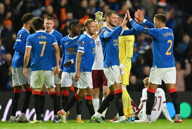 Rangers defender James Tavernier (R) celebrates with teammates after the UEFA Europa League Group A match between Rangers and Sparta Prague at Ibrox Stadium in Glasgow on November 25, 2021. - Rangers won the match 2-0. (Photo by Paul ELLIS / POOL / AFP) (Photo by PAUL ELLIS/POOL/AFP via Getty Images)