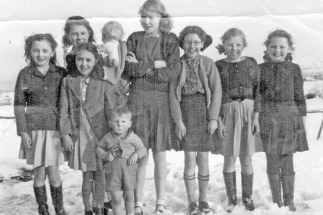 Young Clarion Members at the rear of Sheffield Clarion Clubhouse, Hathersage Road, Ringinglow, Sheffield, in 1947. Pictured clockwise from far left: Gay Walker, Eileen Rudge, Maureen Walker, tallest girl is Sheila Rudge, Pat Southall, Beryl Dealy and far right Joan Stringer. Child on front row is John Dealy.