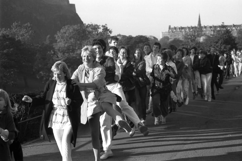 Hundreds of young people turned up in Princes Street Gardens for a giant conga line, raising money for undeprivileged Edinburgh children in October 1985.