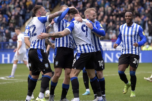 Sheffield Wednesday players celebrate with Lee Gregory after the opening goal.