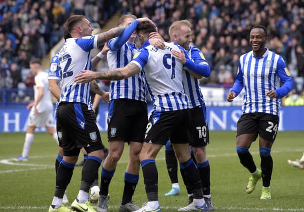 Sheffield Wednesday players celebrate with Lee Gregory after the opening goal.