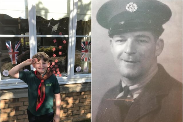 Atten ... shun! William Trattles, 10, pays tribute on Merganser Road to his great-grandfather Frank Smith, who served in the RAF during World War Two.