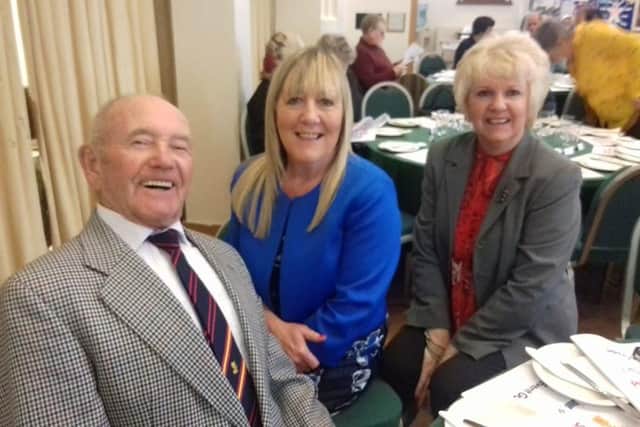 Tony Foulds, Kathy Markwick and entertainer Susan St Nicholas at an awards ceremony.