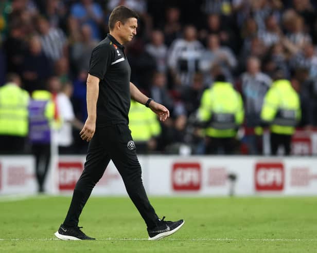 Sheffield United's manager Paul Heckingbottom reacts to their defeat on the pitch after the English Premier League football match between Sheffield United and Newcastle United at Bramall Lane in Sheffield, northern England on September 24, 2023. Newcastle won the game 8-0. (Photo by Darren Staples / AFP) / RESTRICTED TO EDITORIAL USE. No use with unauthorized audio, video, data, fixture lists, club/league logos or 'live' services. Online in-match use limited to 120 images. An additional 40 images may be used in extra time. No video emulation. Social media in-match use limited to 120 images. An additional 40 images may be used in extra time. No use in betting publications, games or single club/league/player publications. /  (Photo by DARREN STAPLES/AFP via Getty Images)