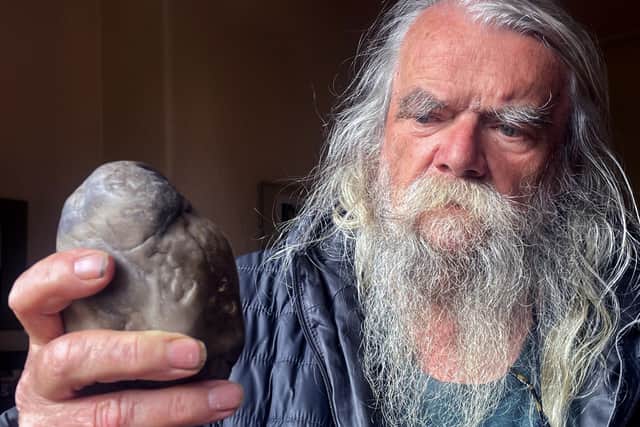 Terry Howard with a stone used as a scraper tool