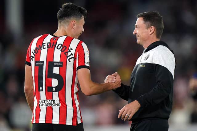 Sheffield United's Anel Ahmedhodzic greets manager Paul Heckingbottom after victory over Reading: Tim Goode/PA Wire.